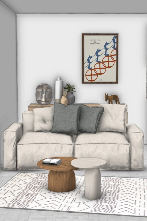 Salon d’un appartement optimisé pour la location avec canapé beige, coussins vert sauge et décoration contemporaine – projet Le Porte de France à Grenoble